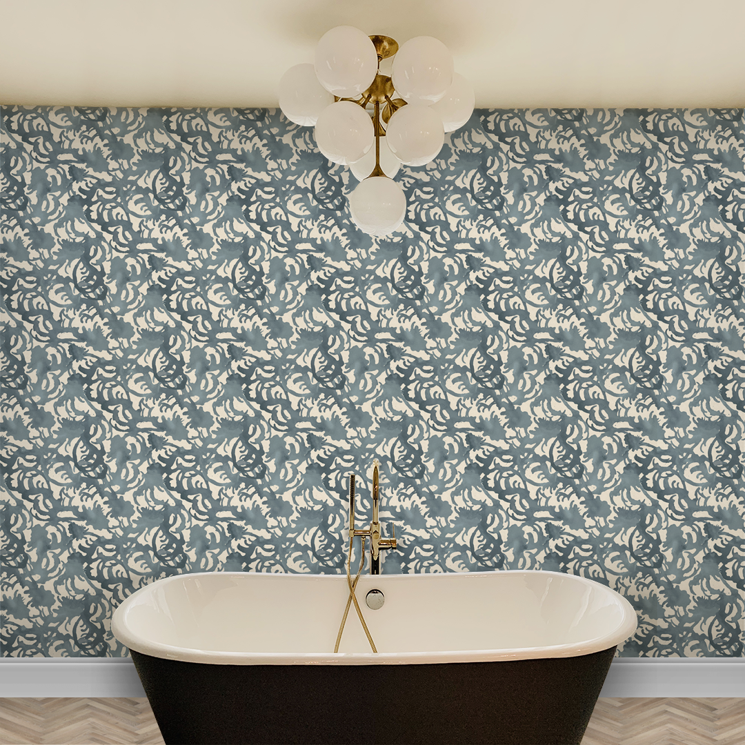 Flourish Storm Blue wallpaper by Angela Simeone wrapping a full bathroom wall behind a freestanding tub