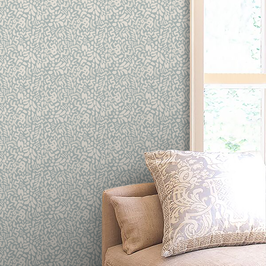 Atelier Blue Haze Medium artist-designed wallpaper wrapping a room behind a sofa, drawn from an original painting by Nashville artist Angela Simeone, from a post on papering ceilings, niches and small rooms.