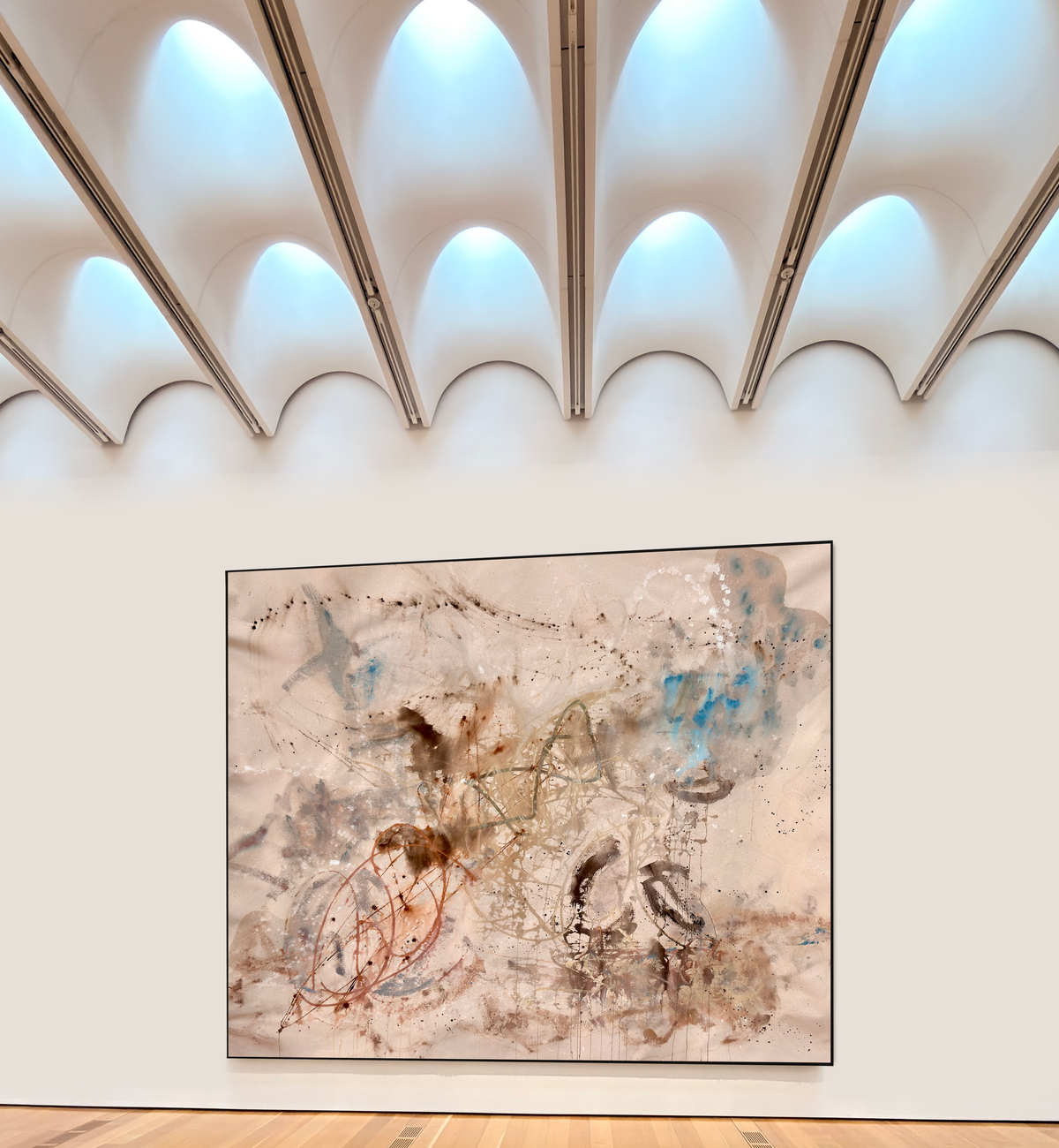 An original abstract painting on a gallery wall seen at viewing distance, by Nashville artist Angela Simeone, from a post on who chooses the art in a hotel and how long it stays.