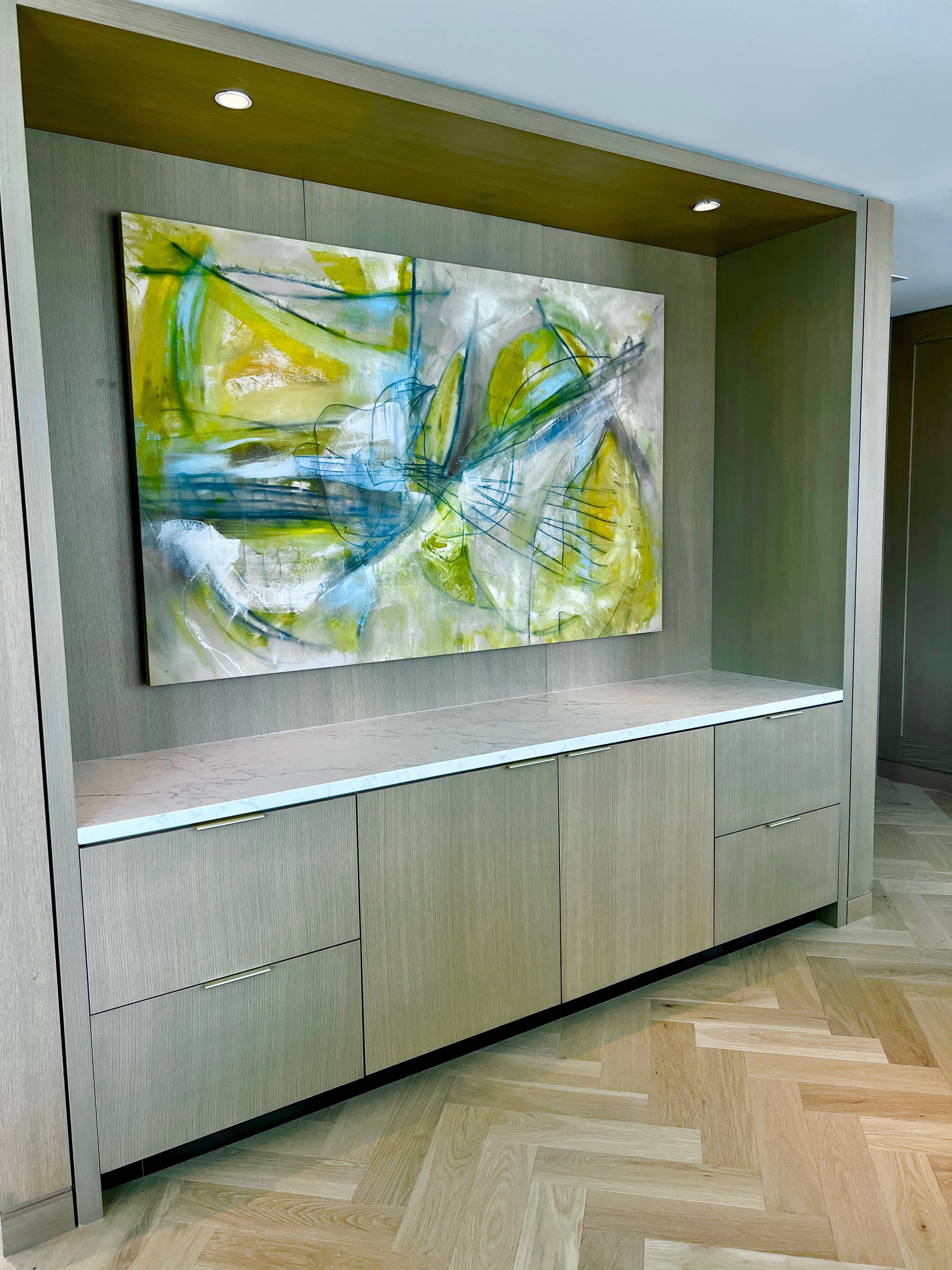 Yellow original abstract painting by Angela Simeone installed in a Conrad Nashville private suite living area